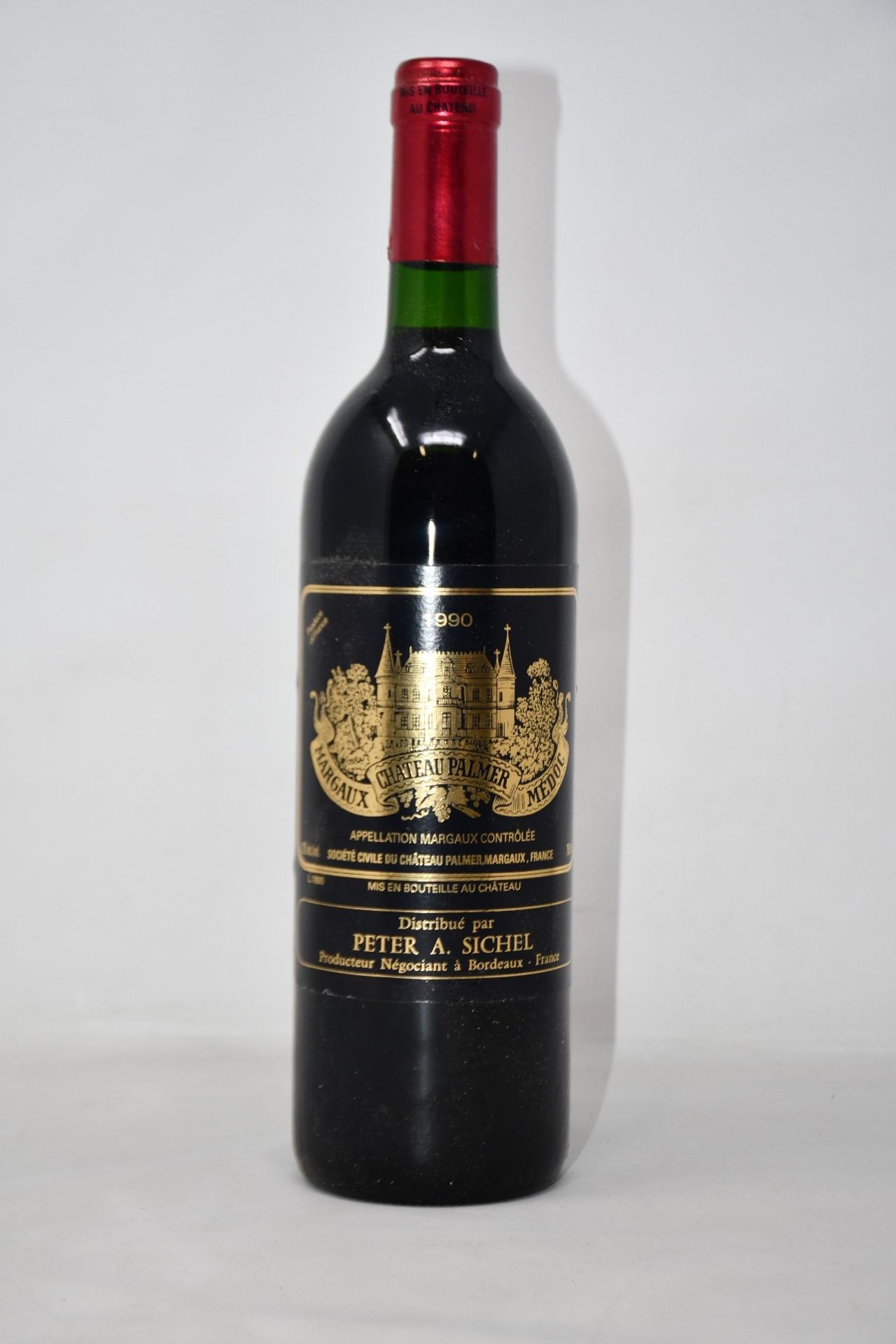 A bottle of 1990 Chateau Palmer Margeaux Medoc (Over 18s only).