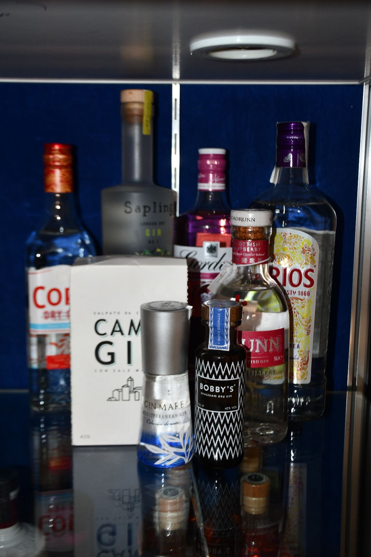 A bottle of Sapling London dry gin (700ml), a bottle of Cork dry gin (700ml), a bottle of Gordon's