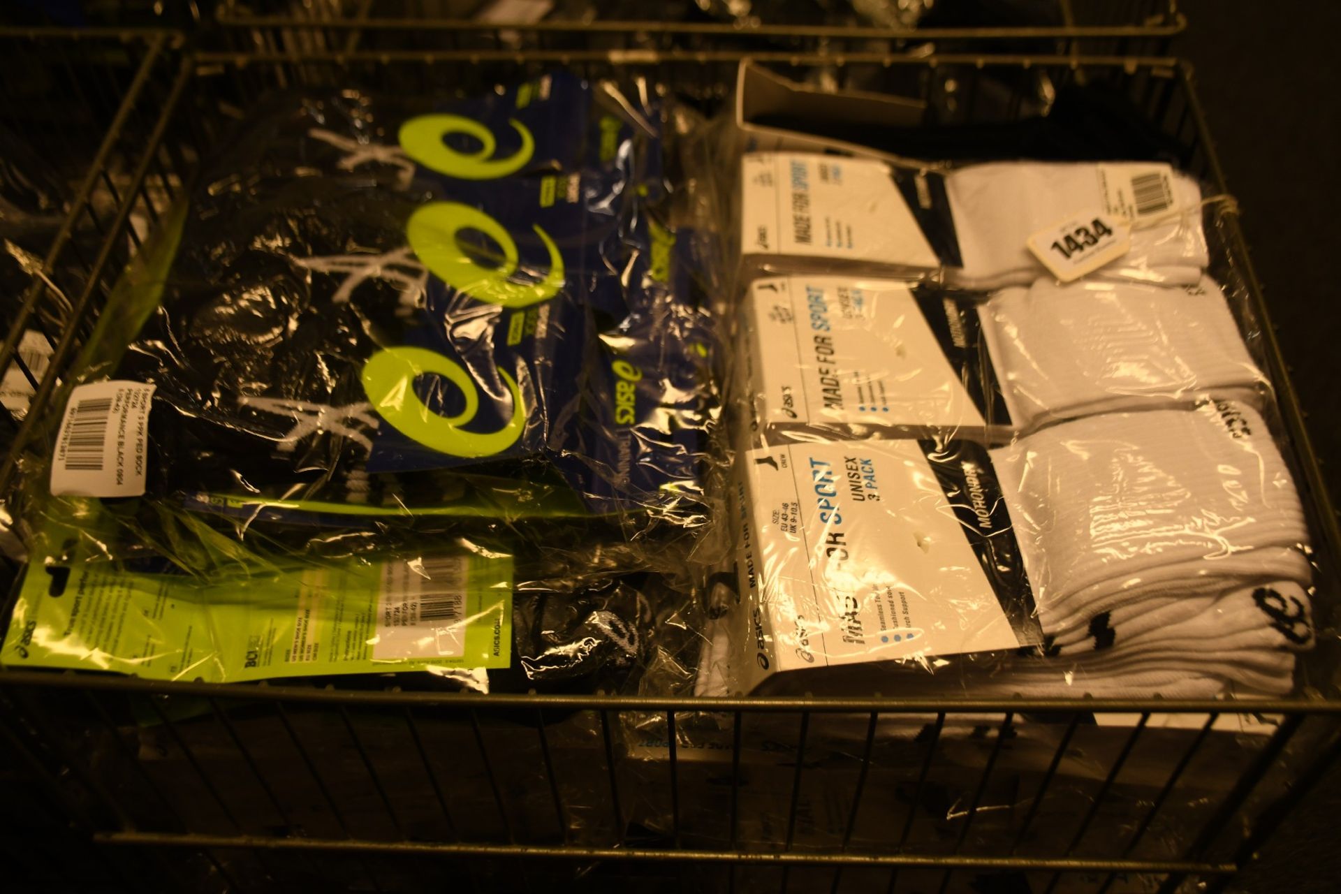 A quantity of assorted as new Asics sports socks.
