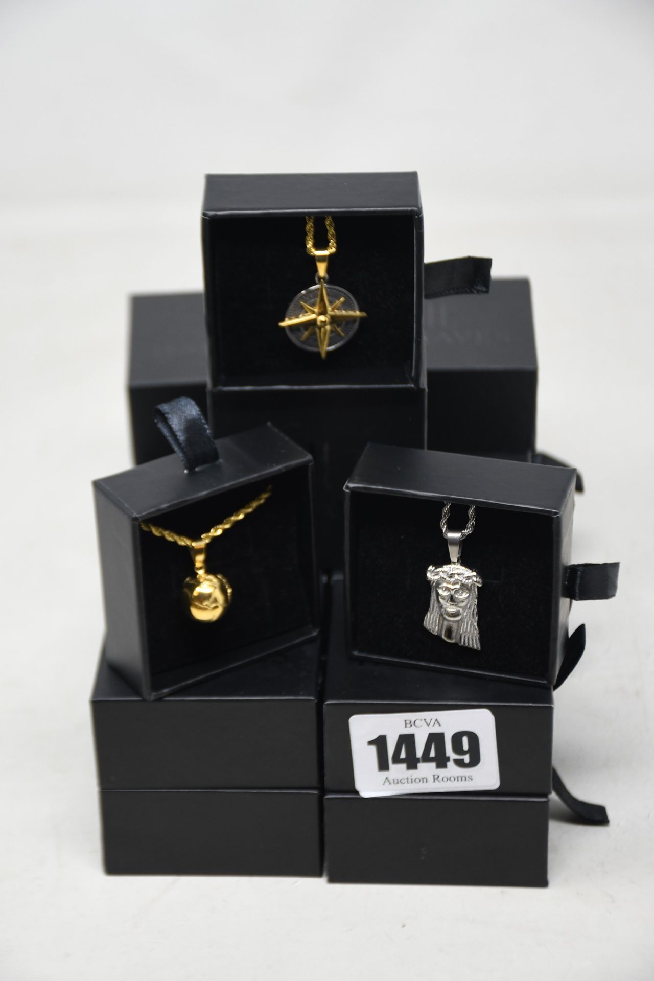 Fifteen assorted Haraves jewellery to include 5x Compass, 5x Globes, 5x Jesus.