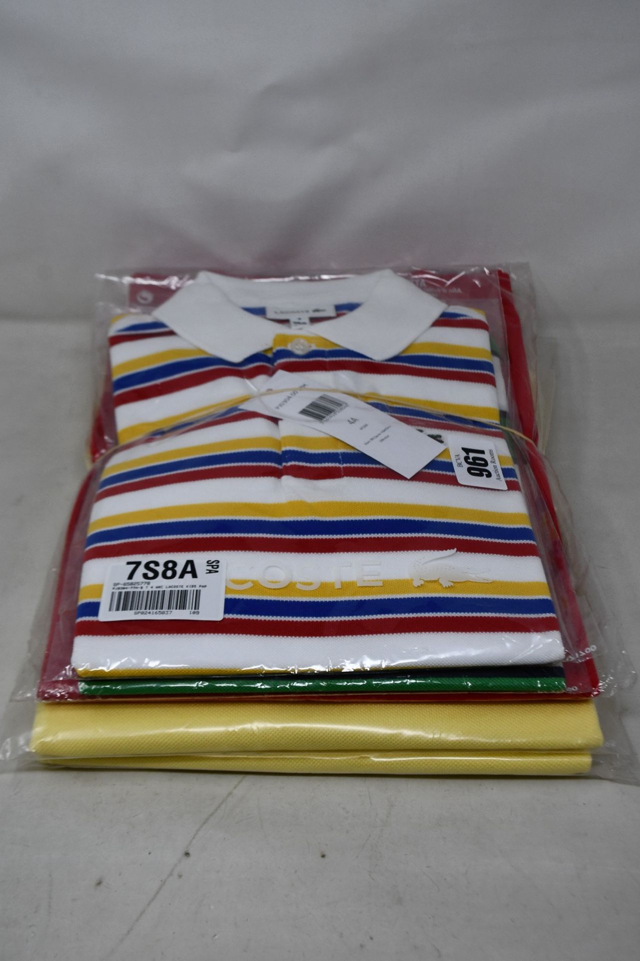 Two men's as new Lacoste polo shirts in yellow (FR 5/US L) and three children's Lacoste polo