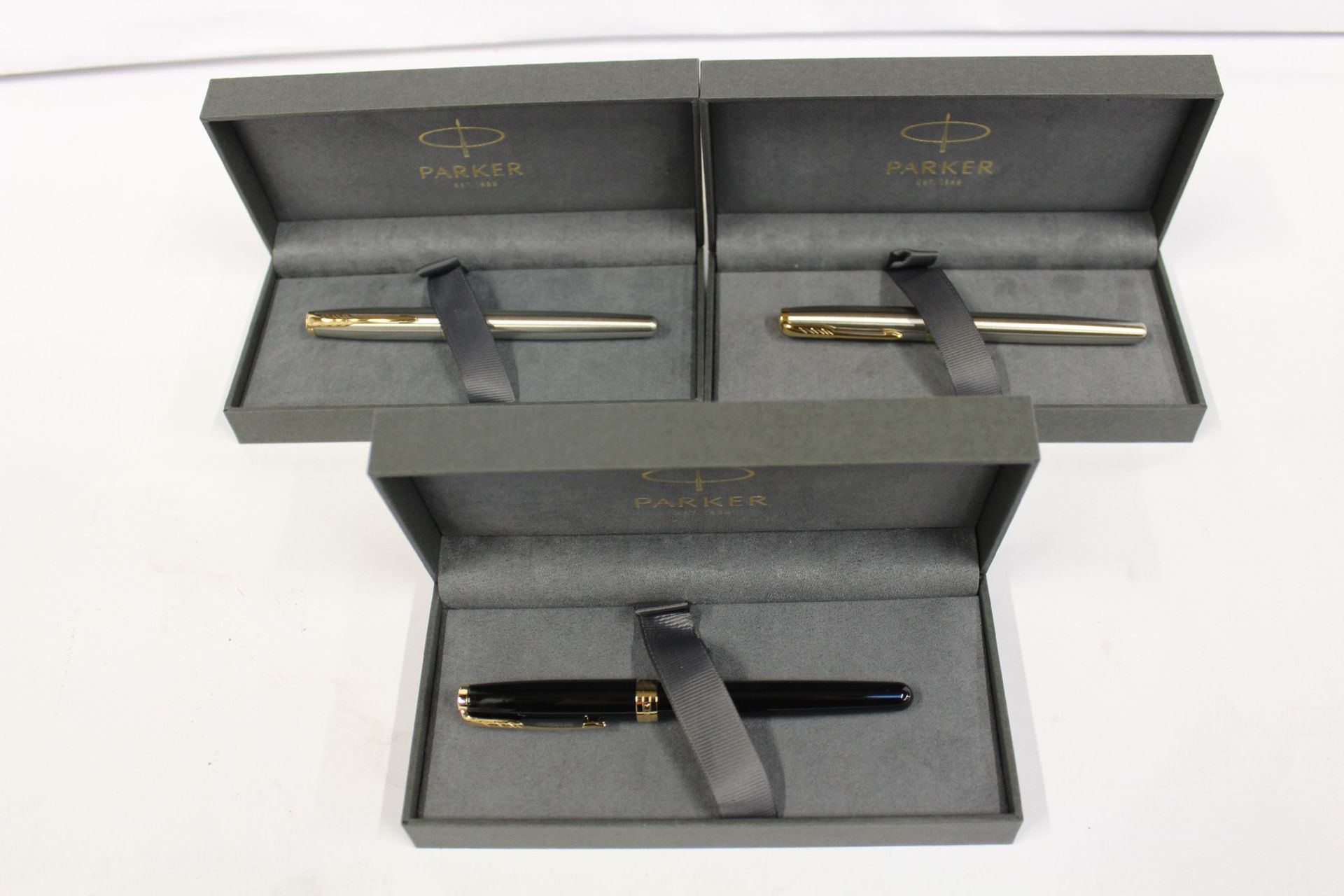 Three boxed as new Parker Sonnet Fountain Pens (2 stainless steel gold trim, 1 black lacquer gold