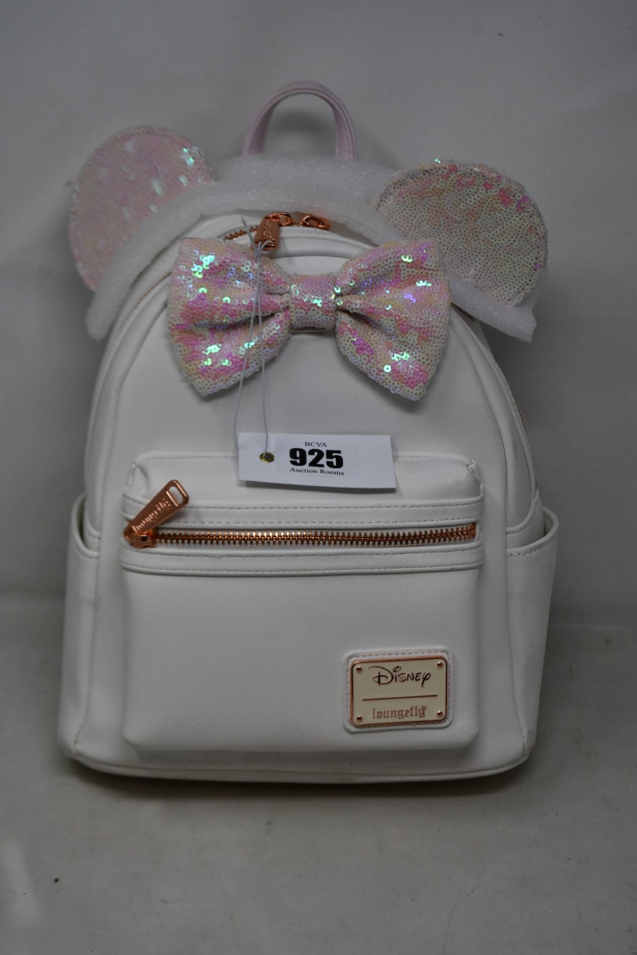 An as new Loungefly Minnie Mouse sequin backpack in white.