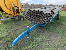 c.70 Wright Rain 5" irrigation pipes with single axle irrigation pipe trailer