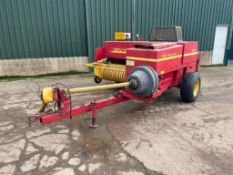 1993 New Holland 570 conventional baler with 65" pick up bed. Serial No: 875302