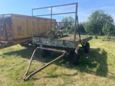 Flat bed bale trailer twin axle with front rave.  NB: Please note that the proceeds from this lot ar