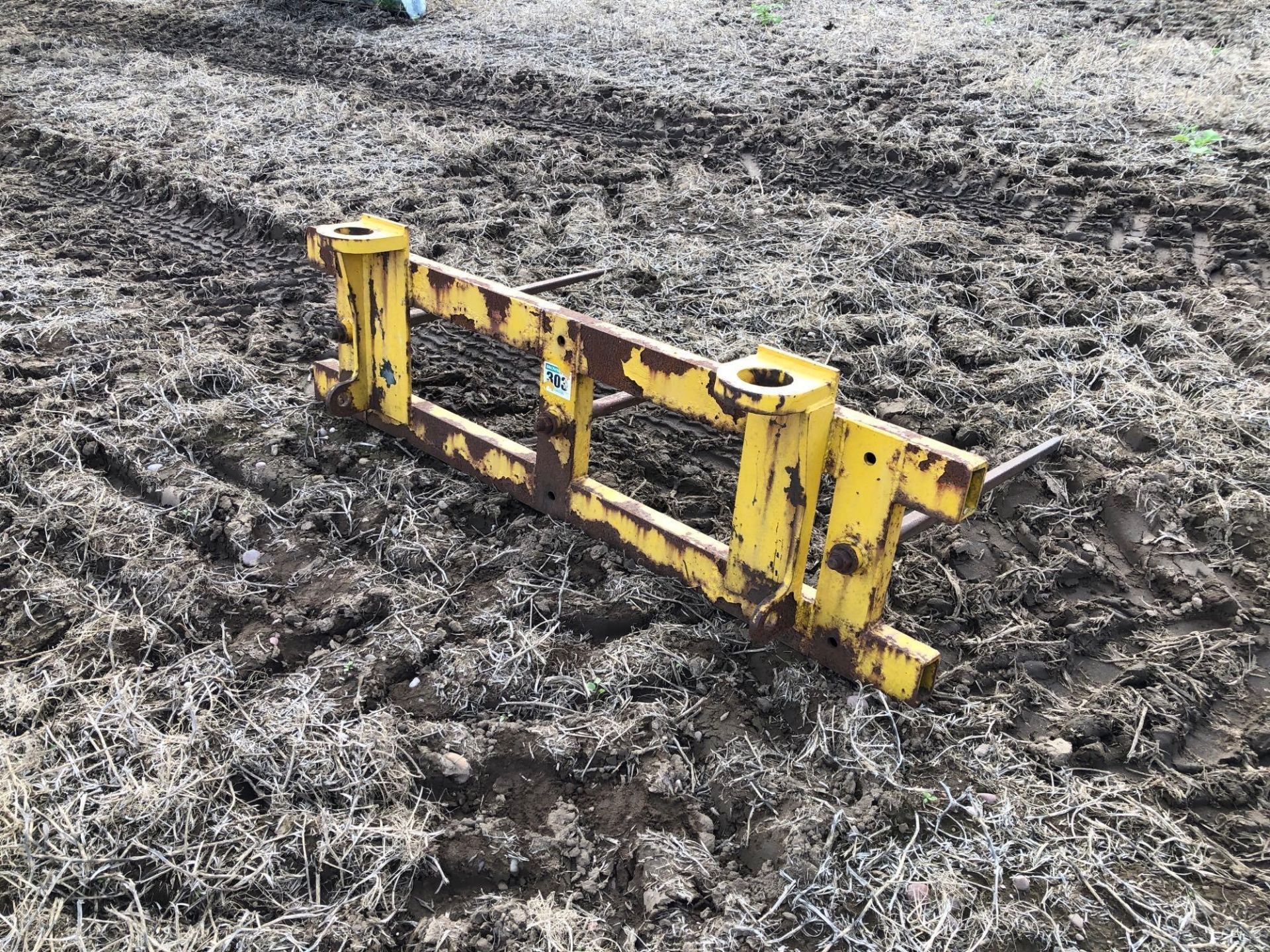 Bale spike with pin and cone attachments