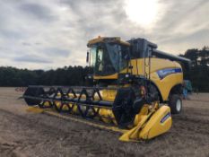2011 New Holland CX5090 combine harvester with 20ft Varifeed header and trolley and straw chopper on