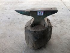 Anvil on wooden block