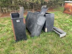 Quantity black plastic pig feeders