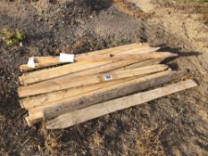 Quantity half round wooden fence posts