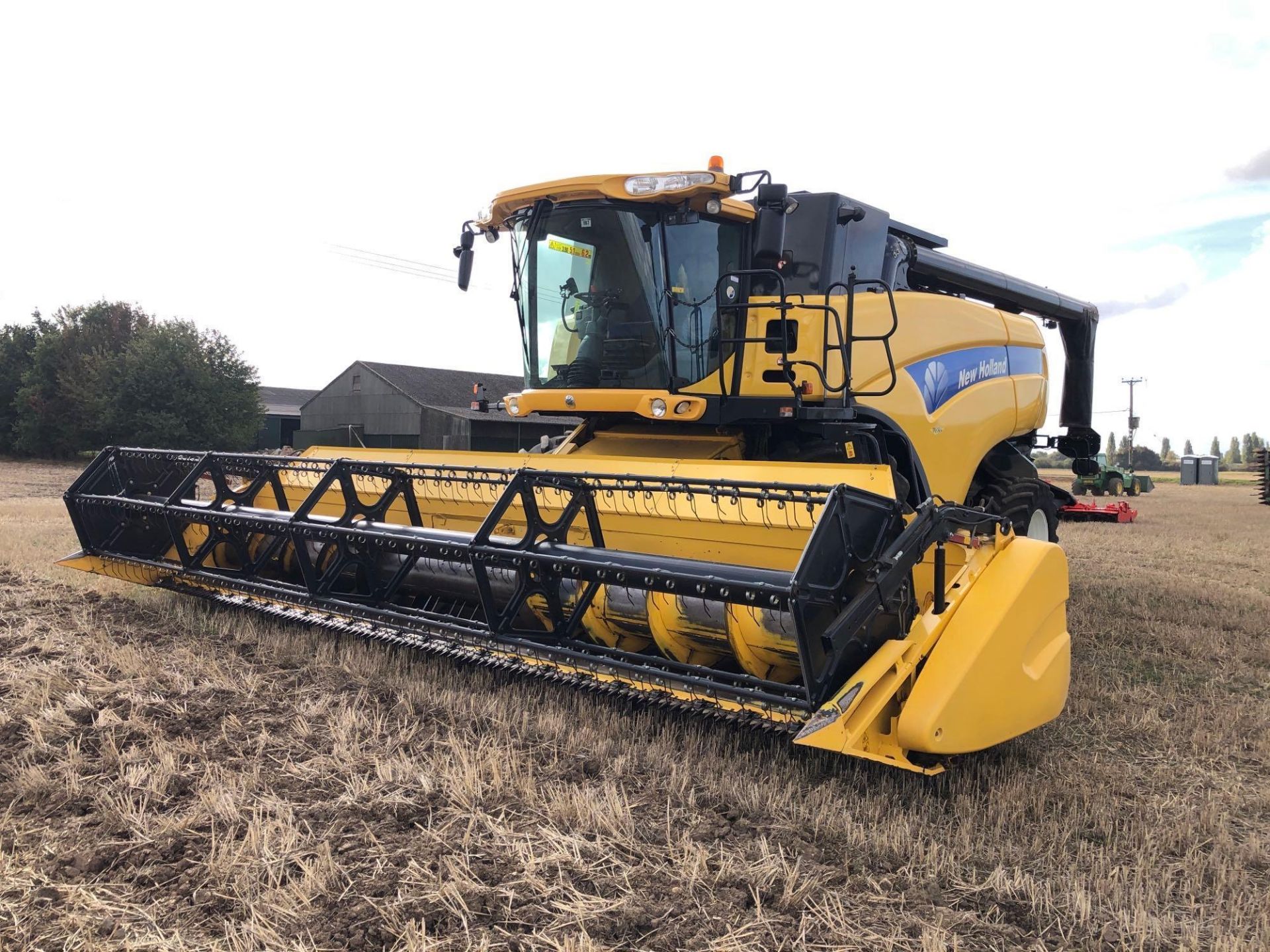 2010 New Holland CX8080 combine harvester with 25ft Varifeed header and trolley, straw chopper, 6 st