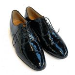 A pair of gents patent leather lace up shoes, size 11