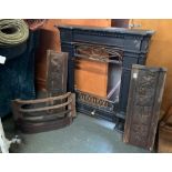 A cast iron fire surround, 64cmW; together with a grate