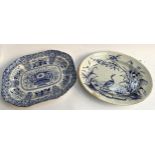 A semi nankeen china blue and white meat plate together with one by Wedgwood depicting heron with