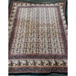 An Indian wall hanging textile with a central ground of elephants and fish within a triple border,