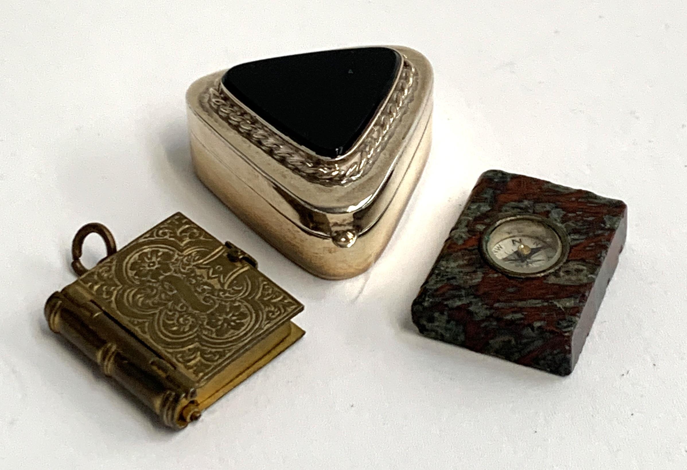 A 925 silver pill box with onyx inset top, 3.5cmW, a gilt metal photograph locket and a compass