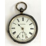 A silver open face key wind pocket watch by H Samuel, Manchester, Roman numerals and outer minute