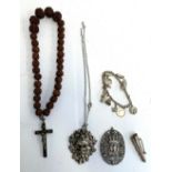 A small lot of white metal items to include a rosary; pierced pendant depicting two nude figures