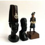 Two hardwood carved African busts, one with badge for Tanganyika police, 21cmH, together with a