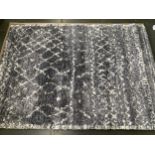 An Alto thick shag salt and pepper rug with a faint geometric pattern, 230x160cm