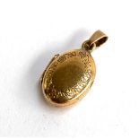 A 9ct gold locket with engraved floral design, approx. 3.6g