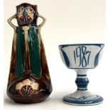 A secessionist style glazed twin handled vase, marked 359 to base, possibly Minton, 26.5cmH,