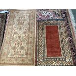 Two small wool rugs, one 156x84cm and the other 120x78cm