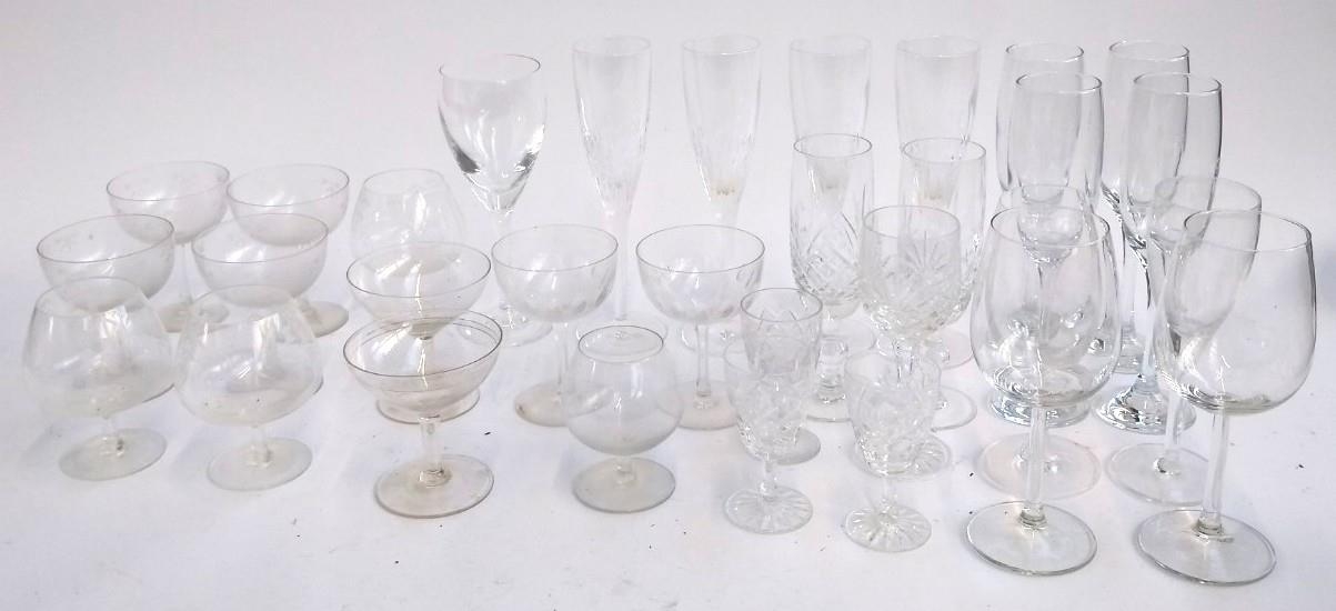 A set of 4 Stuart crystal champagne flutes together with a quantity of other wine glasses etc