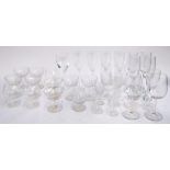 A set of 4 Stuart crystal champagne flutes together with a quantity of other wine glasses etc