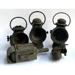 Three railway lanterns, a carriage lamp with bevelled glass and an Amal Birmingham vintage