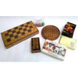 A mixed lot of games to include folding chess board, solitaire board, marquetry cribbage board,