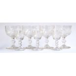 A set of four large and three smaller Regency wine goblets, engraved with fox hunting scenes,