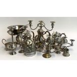 A mixed lot of plated wares to include 3 piece tea set, candlesticks, some flatware, vases, etc