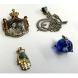A small lot to include a WWII gilt metal and enamel photographic badge commemorating the 1938
