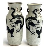 A pair of stoneware crackleglaze vases, with applied prunus decoration, depicting dragon and foo