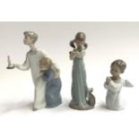 Three Lladro figurines, siblings in night dress, girl with kitten and praying cherub, the tallest