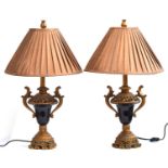 A pair of gilt wood mounted dark glass lamp bases, modern, in the early 19th century French style,