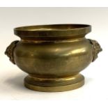 A Chinese brass censer with twin devil mask handles, 20cmD