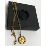 An Effra 925 'Home' pendant in the form of a wax seal, matte gold finish, chain 58cmL, 8.1g, boxed