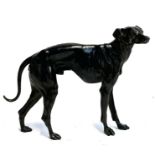 A bronze figure of a whippet, marked to base, 20cmH