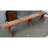 An early 20th century long oak bench, 230x30x40cmH