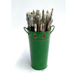 A green enamel pot of artists brushes to include Winsor and Newton, Gurstaecker, Raphael, L