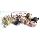 A mixed lot of teapots mainly oriental to include a Japanese lustre part coffee service