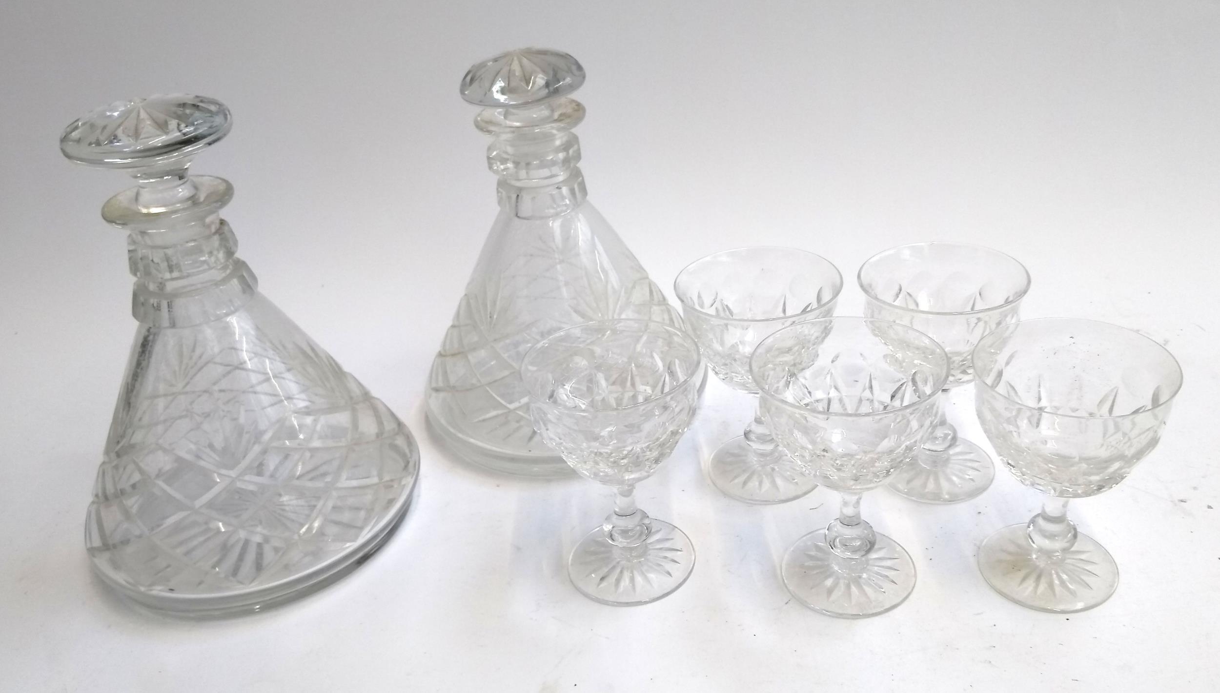 Two cut glass ships decanters, the tallest 22.5cmH, together with 5 Tudor crystal glasses and 4