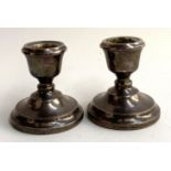 A pair of small 20th century silver candlesticks, each 7cmH