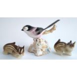 An Abbeydale bone china long tailed tit heightened in gilt, together with 2 USSR chipmunks