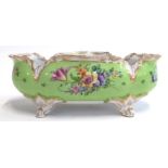 A Dresden hand painted footed oblong bowl with floral spray design, heightened in gilt, marked to