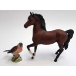 Two Beswick figurines, a brown horse, 17cmH; together with a Chaffinch, incised 166 (2)