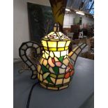 A stained glass lamp in the form of a teapot, 24cmH